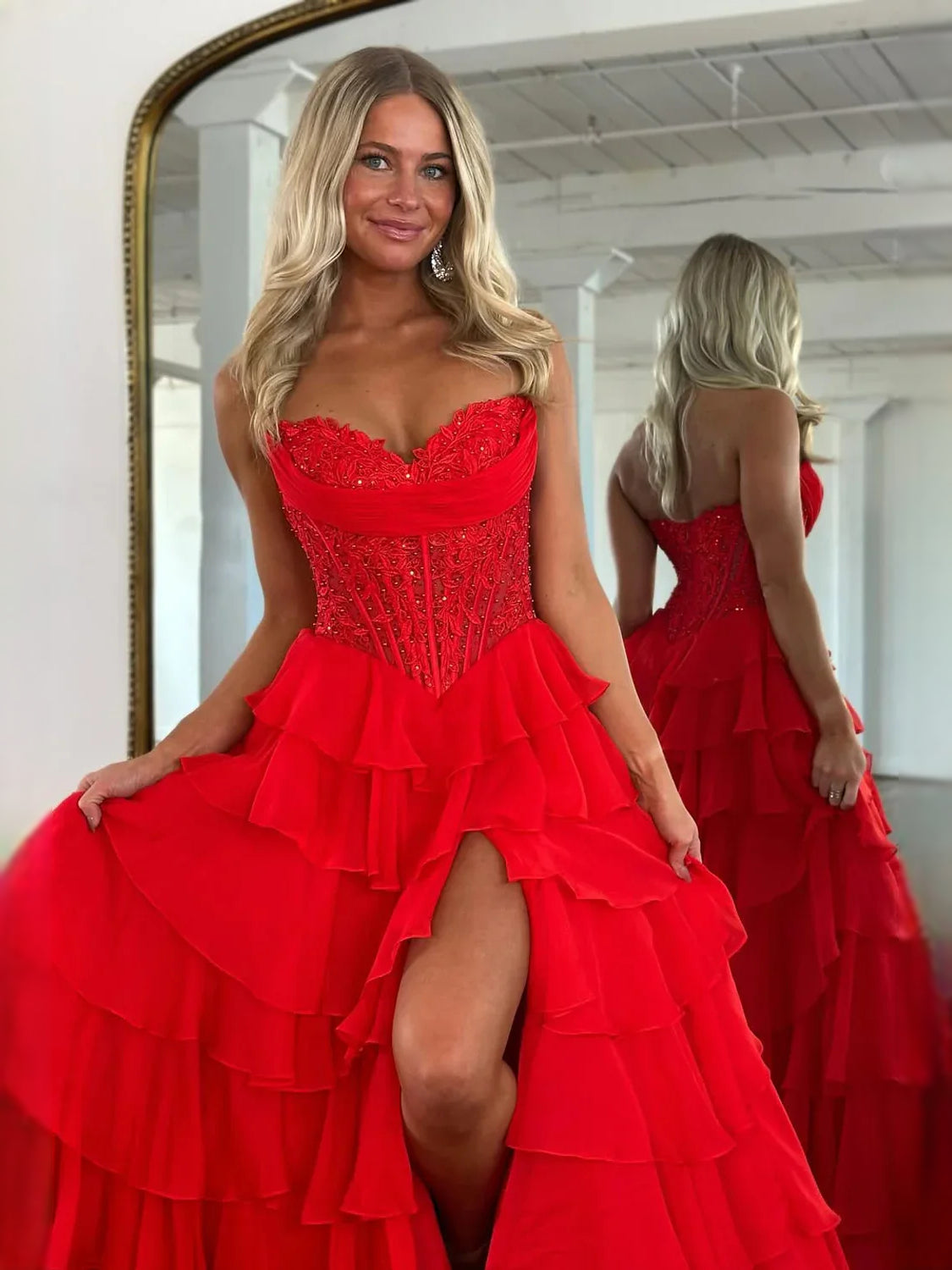 Red strapless corset prom dress with beaded bodice, tiered ruffles and side slit