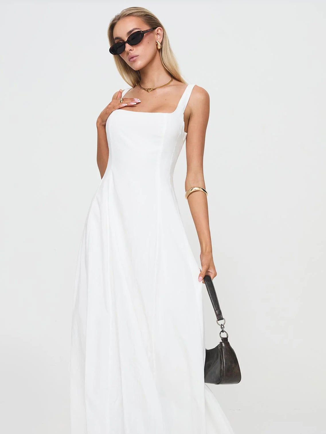 White formal dress with structured woven fabric construction and maxi hem