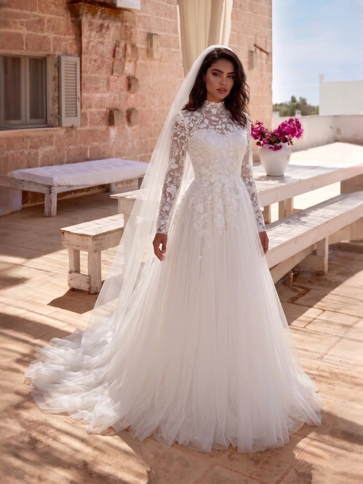 Ivory high-neck embroidered tulle A-line wedding dress with long sleeves and layered skirt