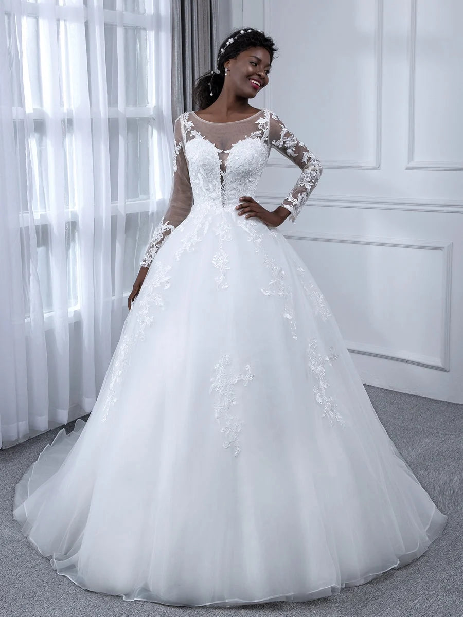 Ivory A-line tulle wedding dress with floral lace bodice, full skirt, and long sleeves