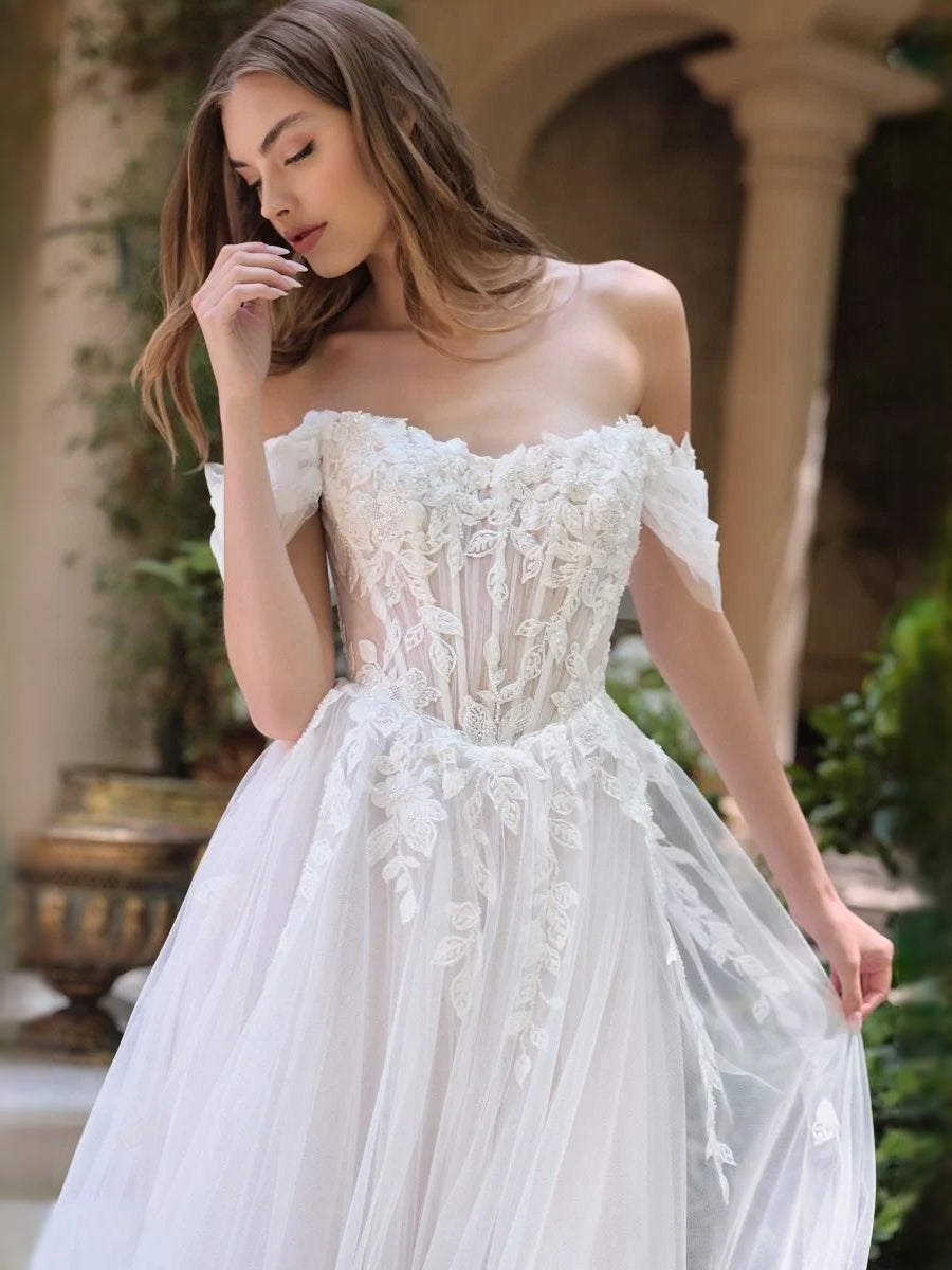 Ivory tulle wedding dress with off-shoulder sweetheart neckline and floral lace corset