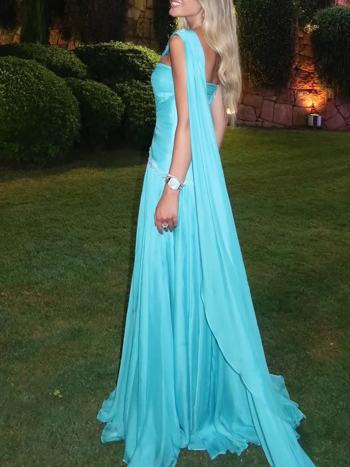 Aqua sweetheart A-line prom dress with pleated skirt and flowing drape panel