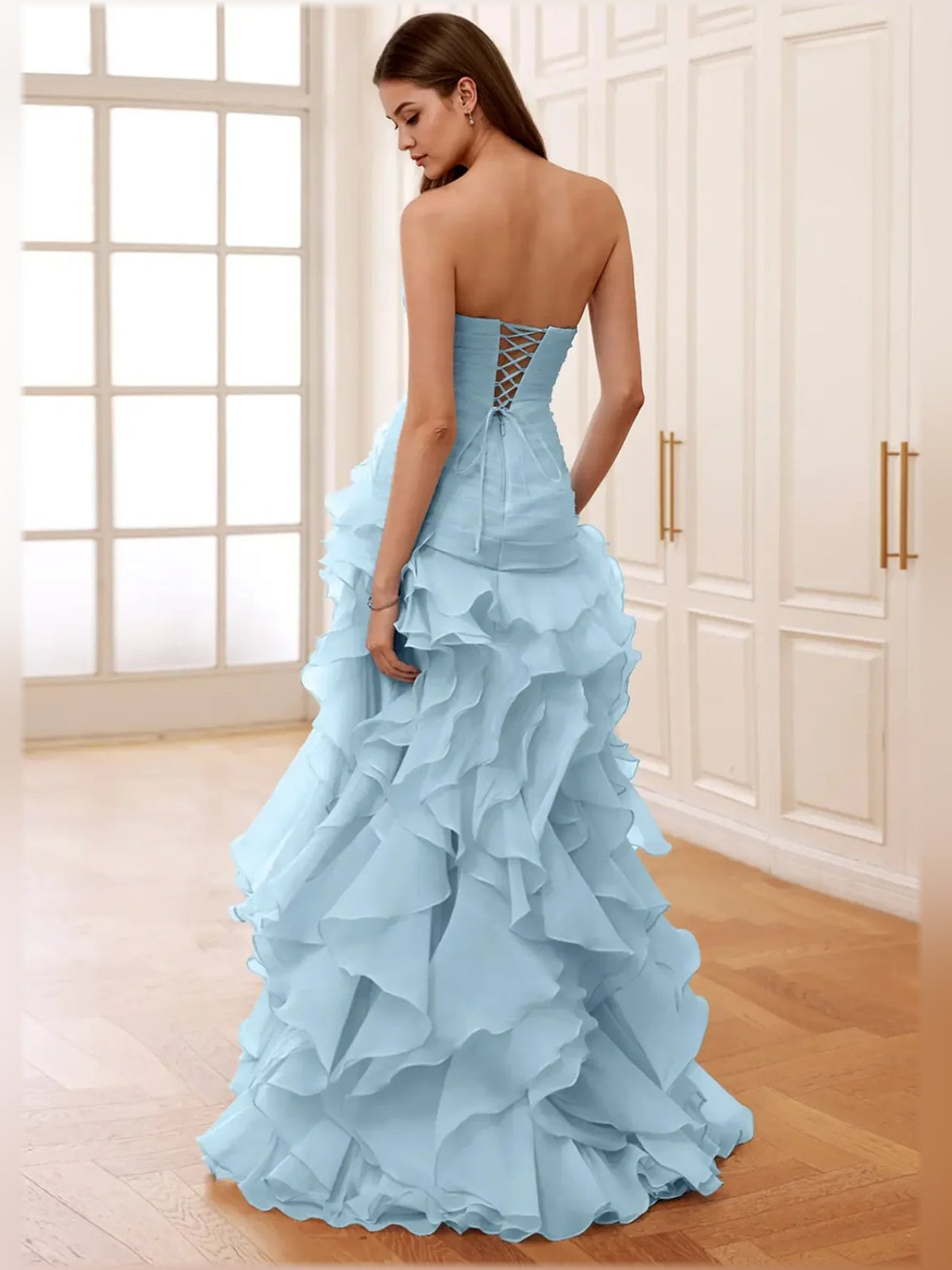 Sky-blue strapless formal dress with open back crisscross lacing and ruffled skirt
