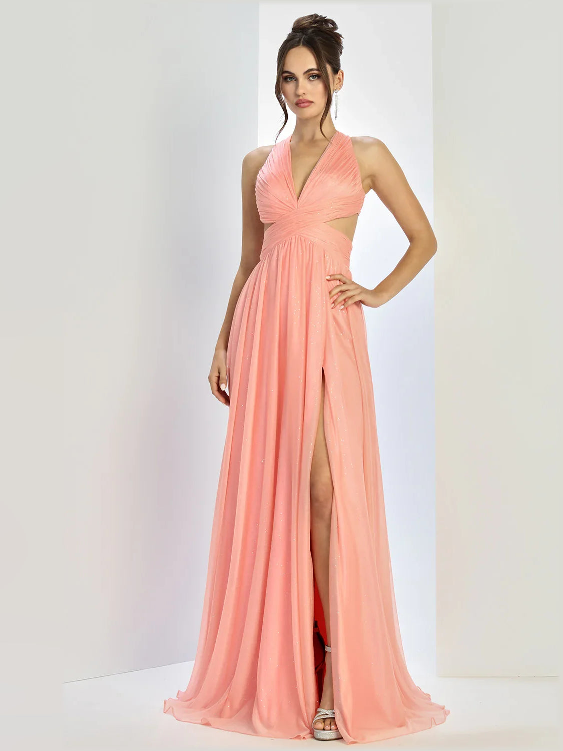 Coral halter neck formal dress with V-neckline and long slit skirt