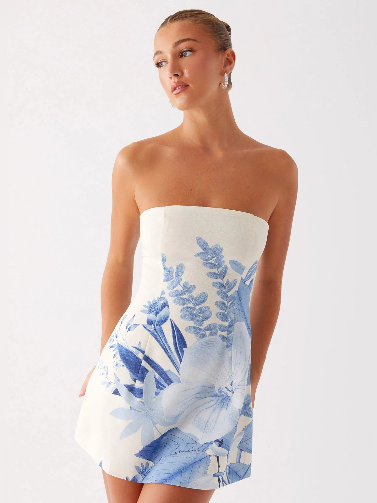Blue floral strapless mini homecoming dress with draped floral skirt detail