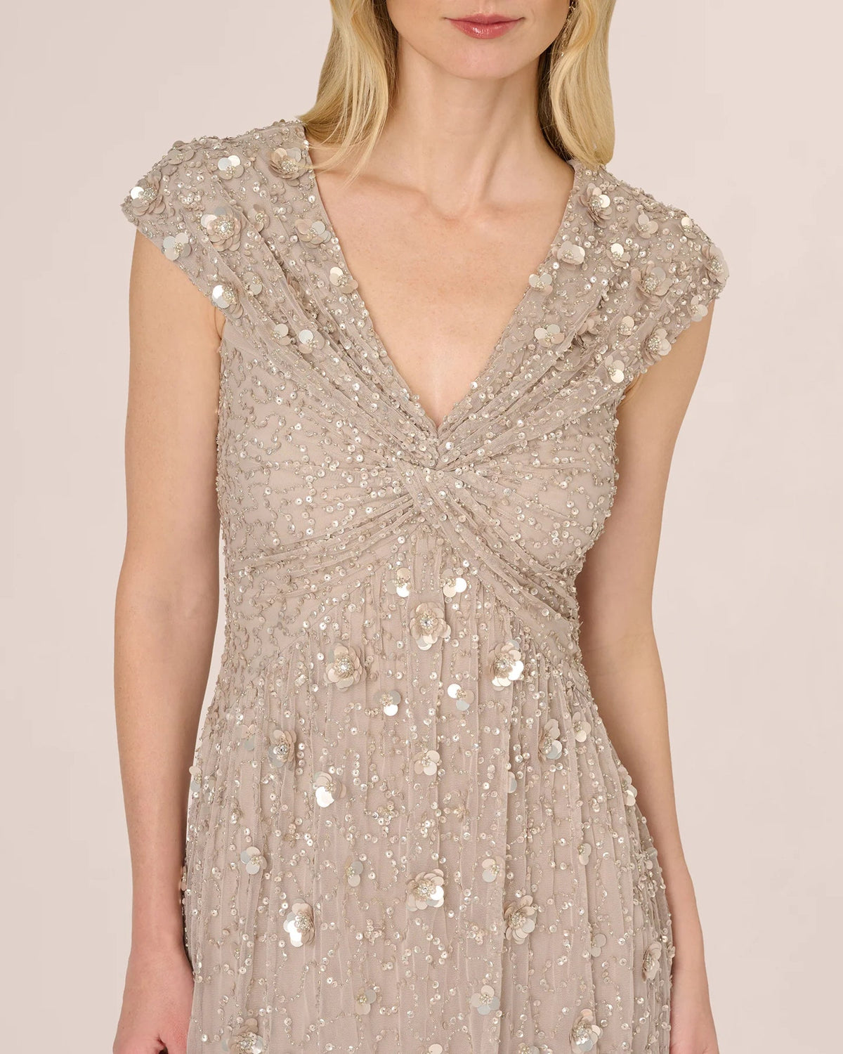 Silver cap-sleeve V-neck dress with draped neckline and floral sequin bead details