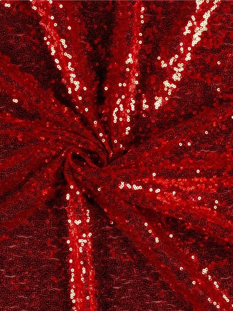 Close-up of burgundy sequin fabric on a formal one-shoulder mermaid dress