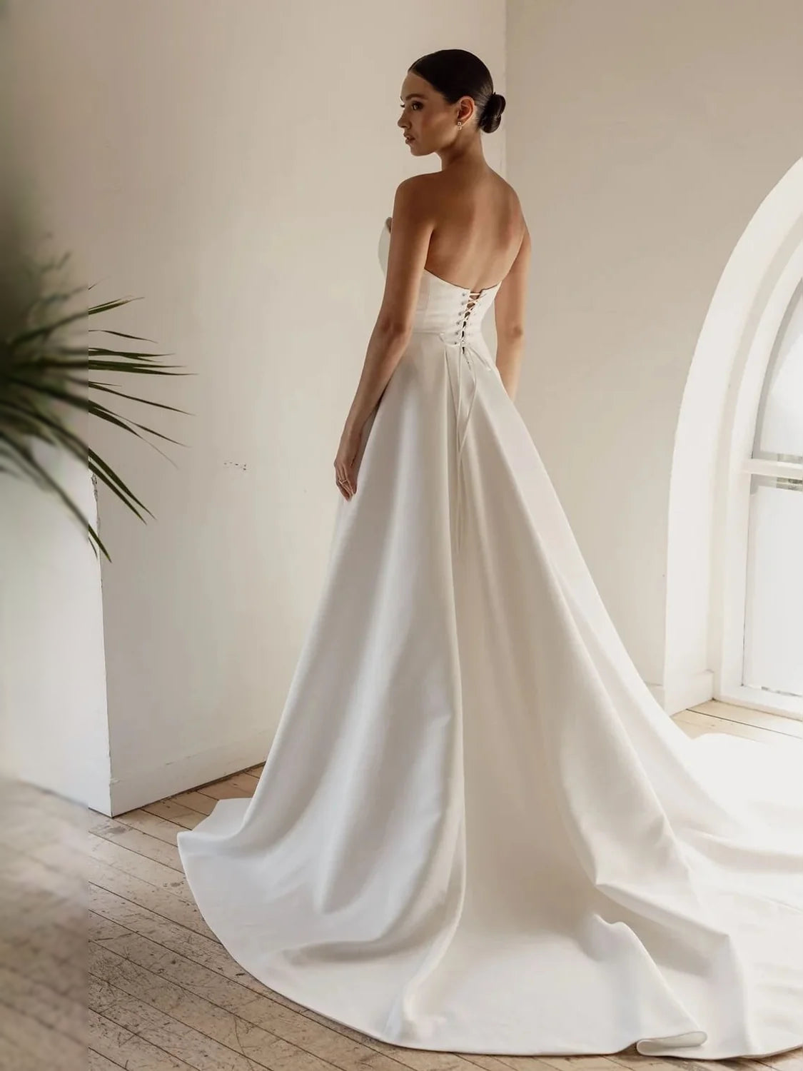 Ivory satin strapless ballgown with full A-line skirt and fitted bodice