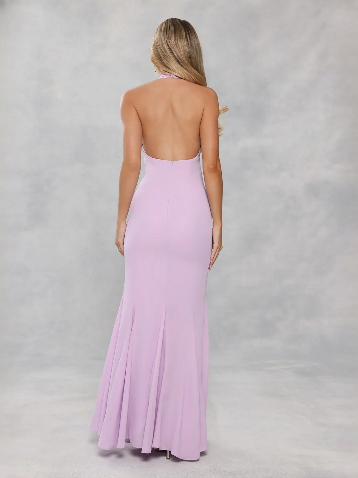 Back view of lavender halter mermaid maxi prom dress with open back