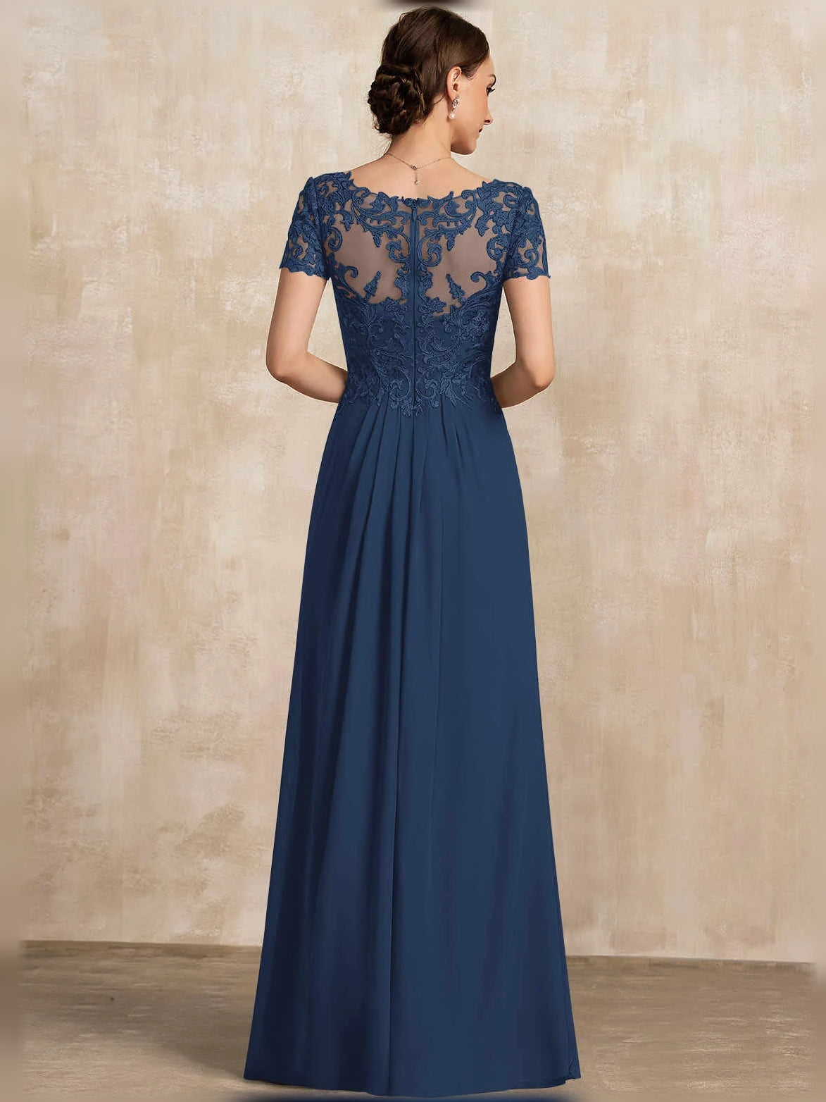 Dark blue back view A-line chiffon dress with lace cap sleeves and pleated skirt