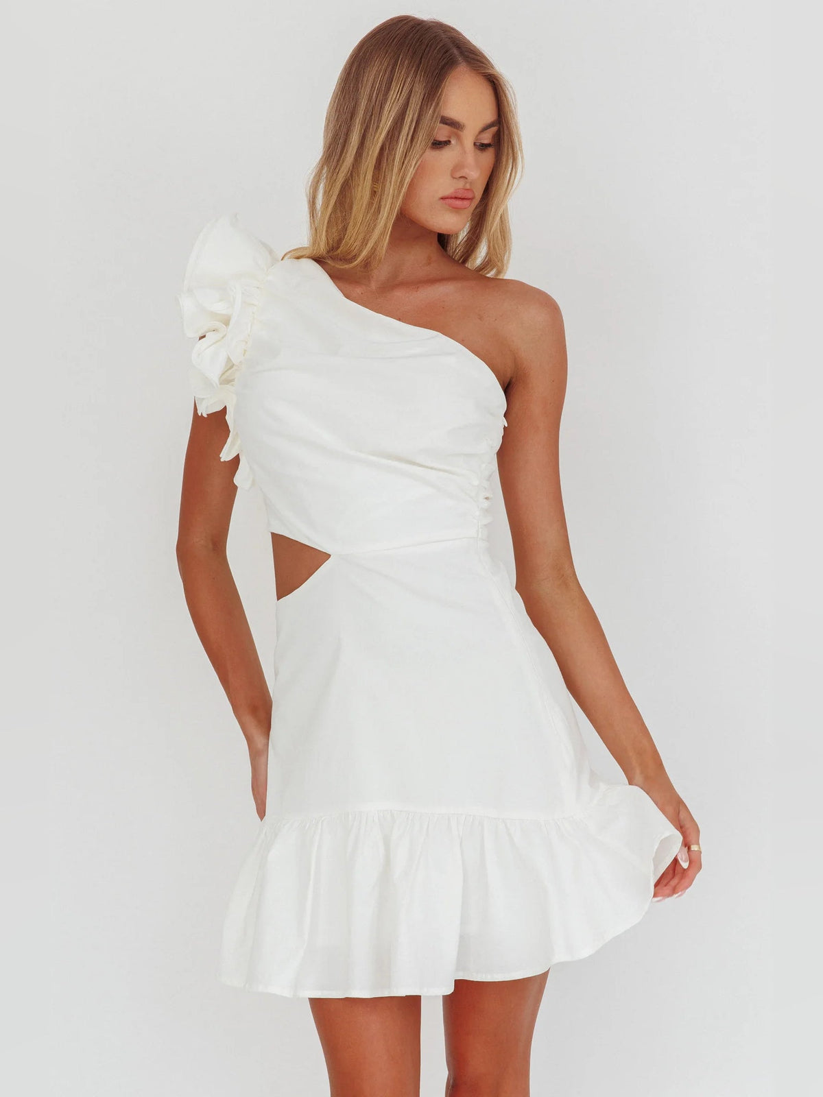 White one-shoulder mini dress with waist cut-out and tiered ruffle skirt