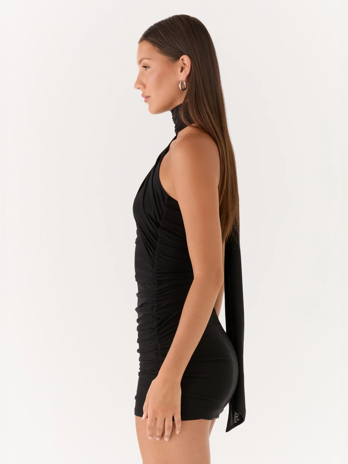 Black ruched mini halter dress with draped back scarf, sleeveless