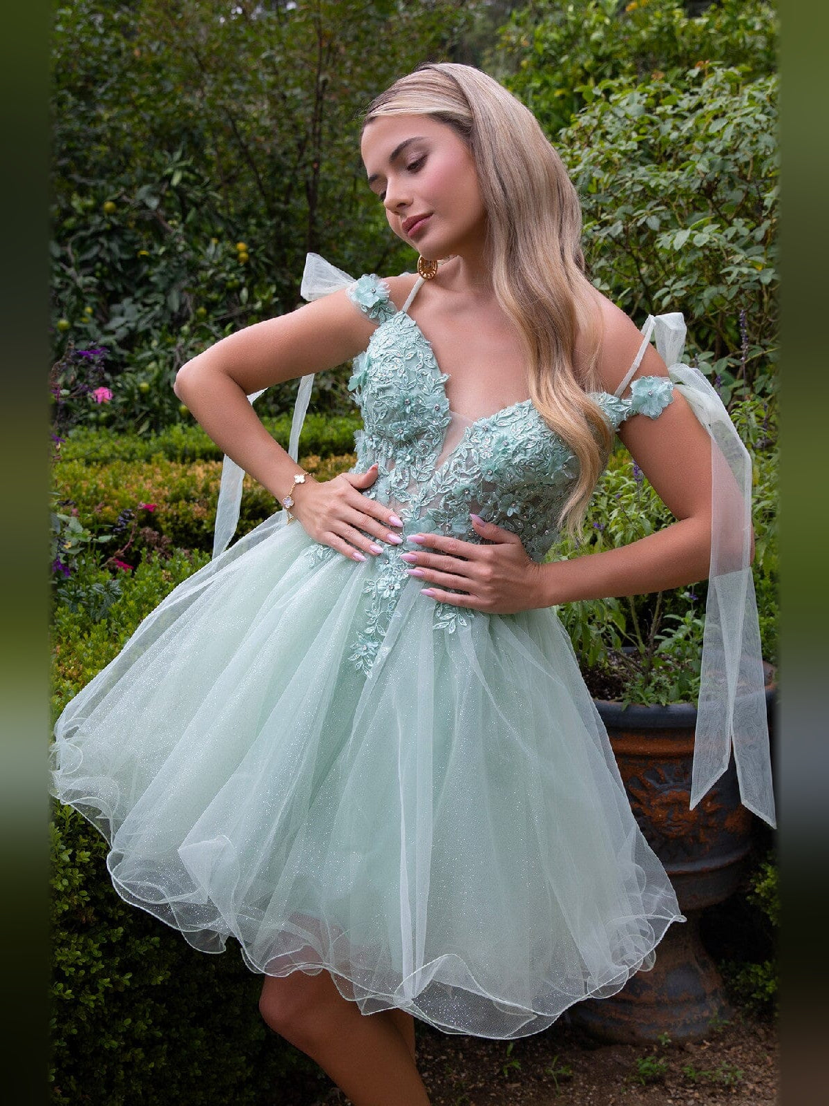 Mint tulle A-line dress with V-neck, floral appliqué and bow shoulder ribbons