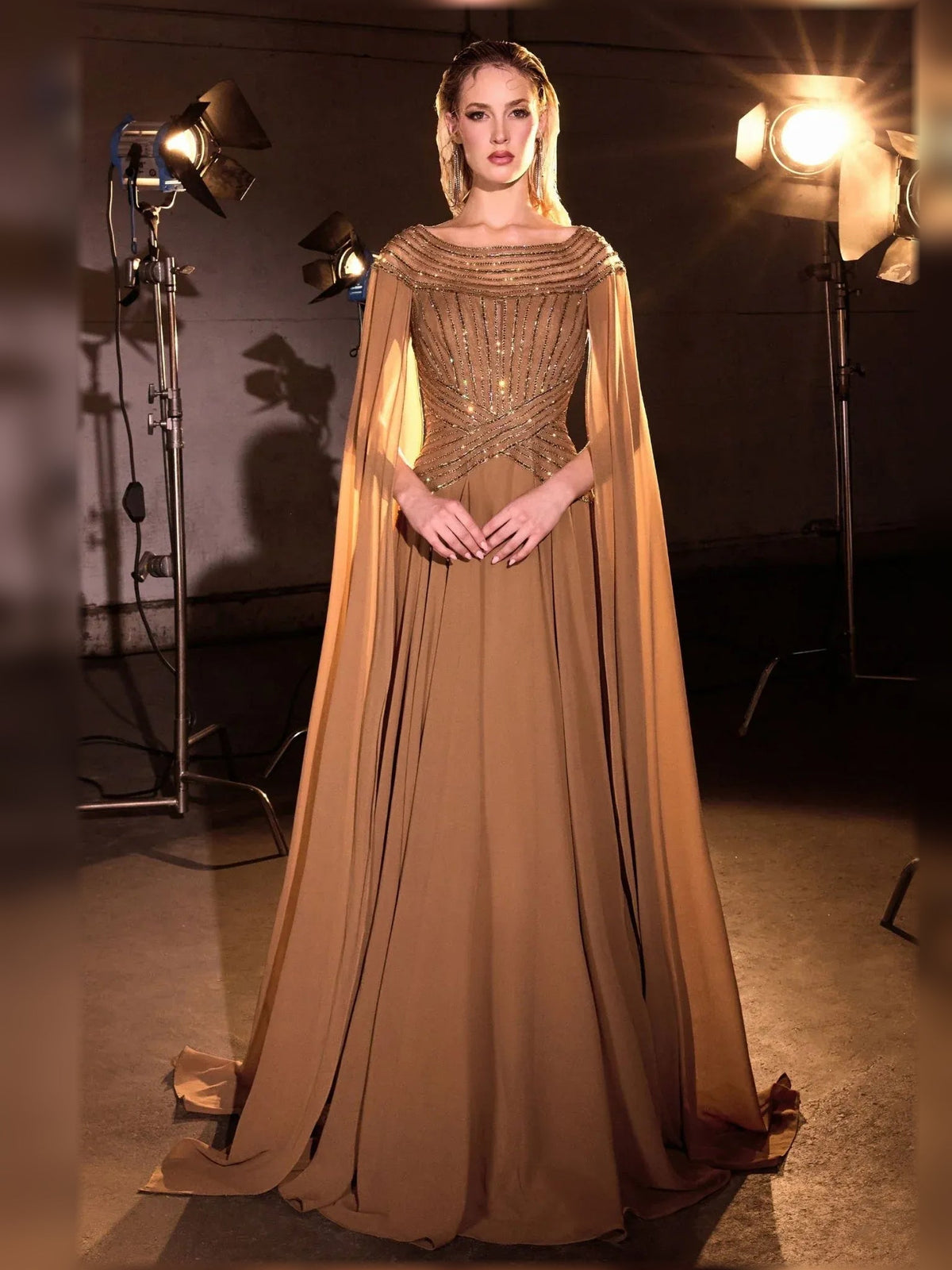 Bronze beaded chiffon mother-of-the-bride dress with off-shoulder neckline and flowing cape sleeves