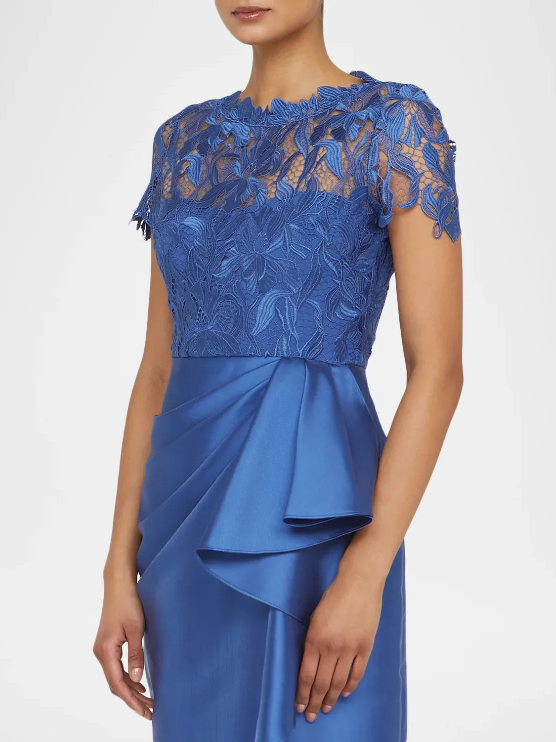 Blue satin sheath dress with floral lace top, draped waist bow and layered ruffles.