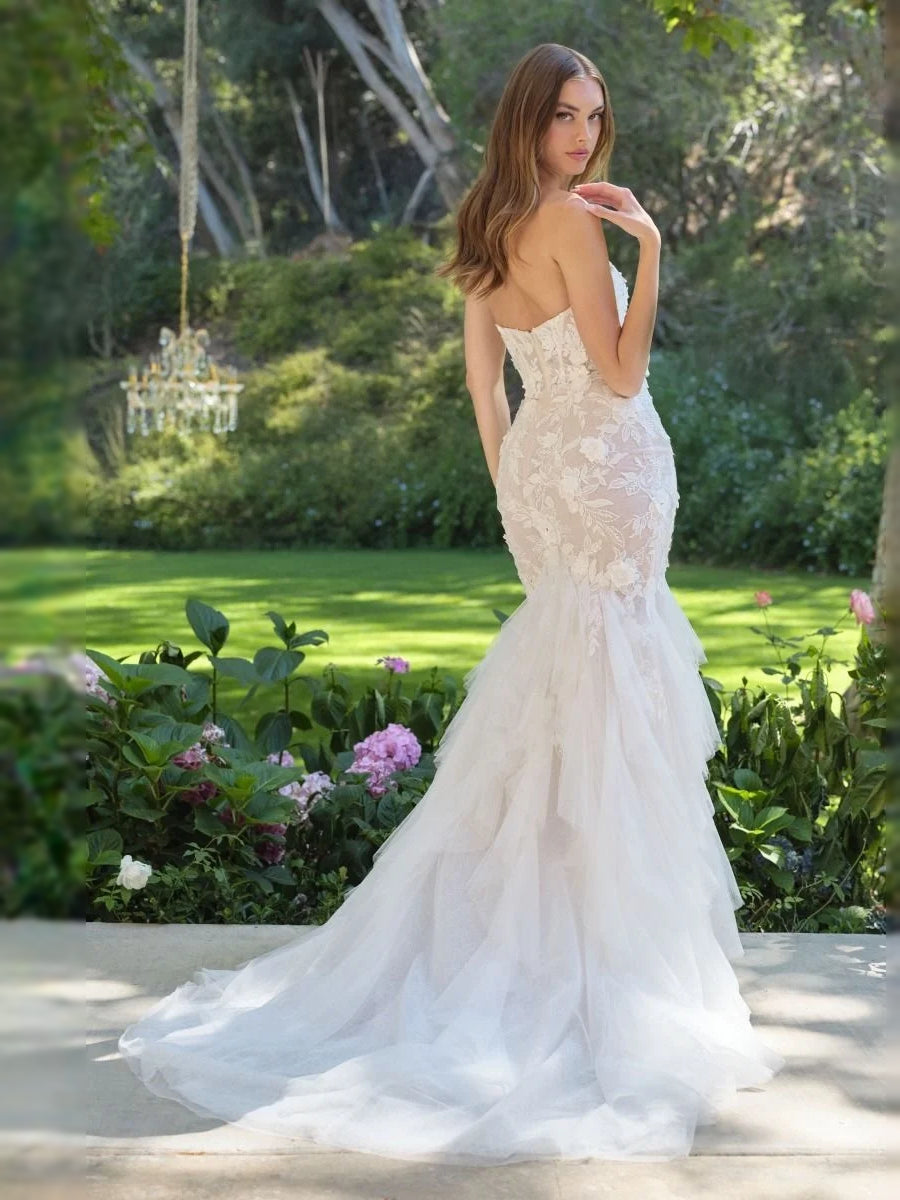 Ivory lace sweetheart mermaid wedding gown with flowing tulle ruffles