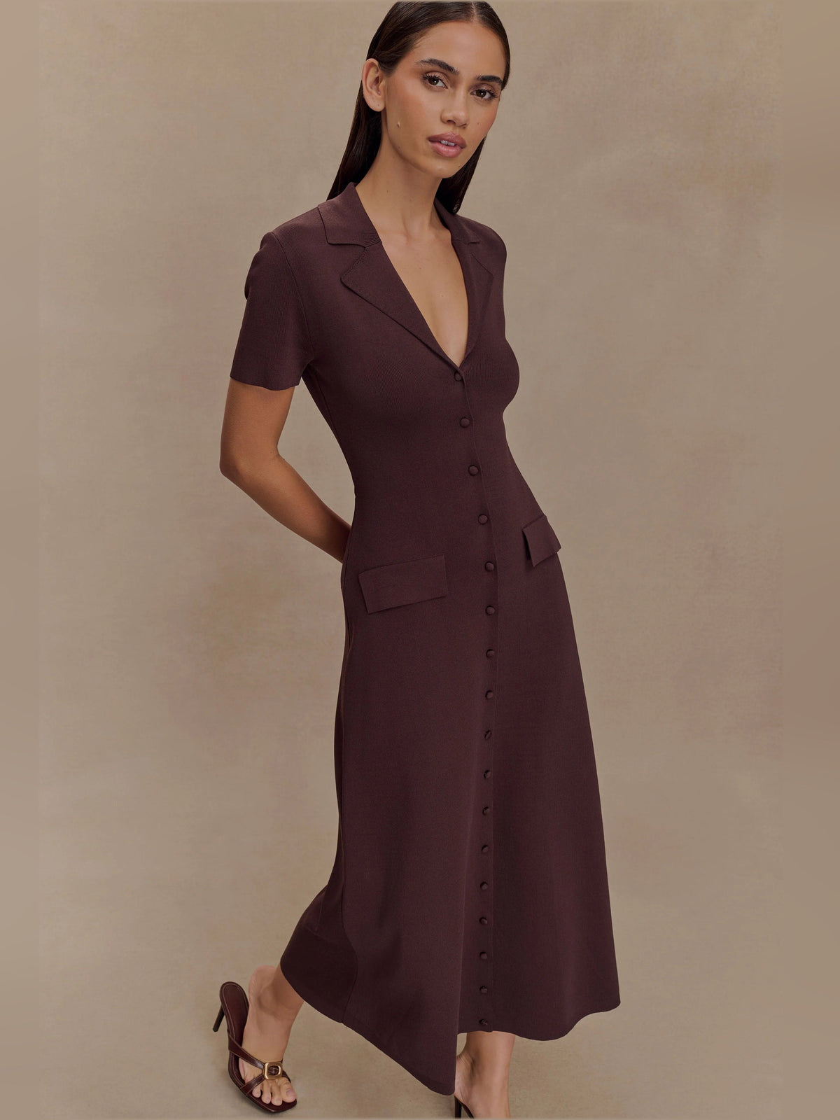 Chocolate-brown V-neck knit midi dress with short sleeves, button front, and side pockets