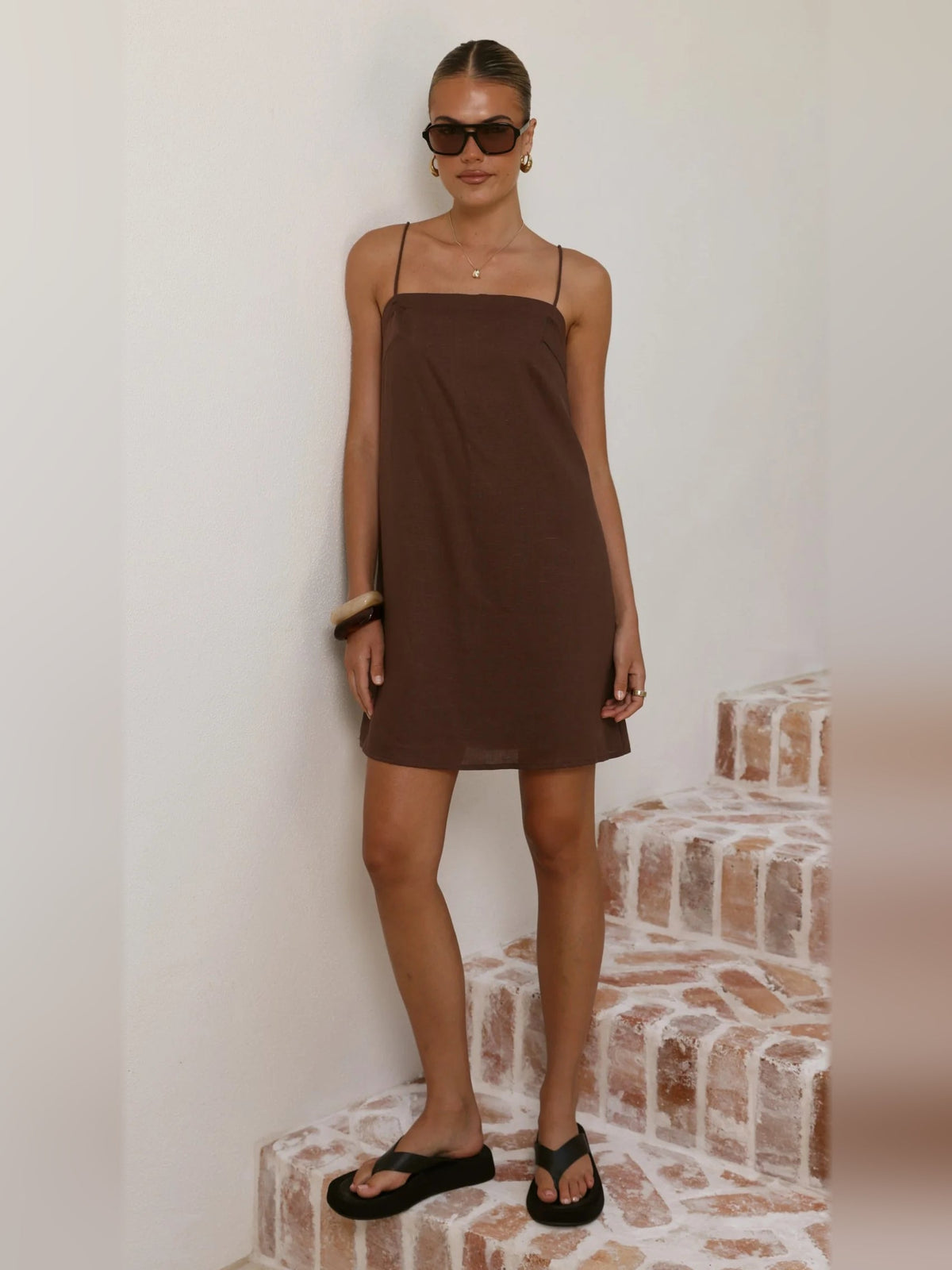 Brown mini dress with spaghetti straps, square neckline, straight shift hem