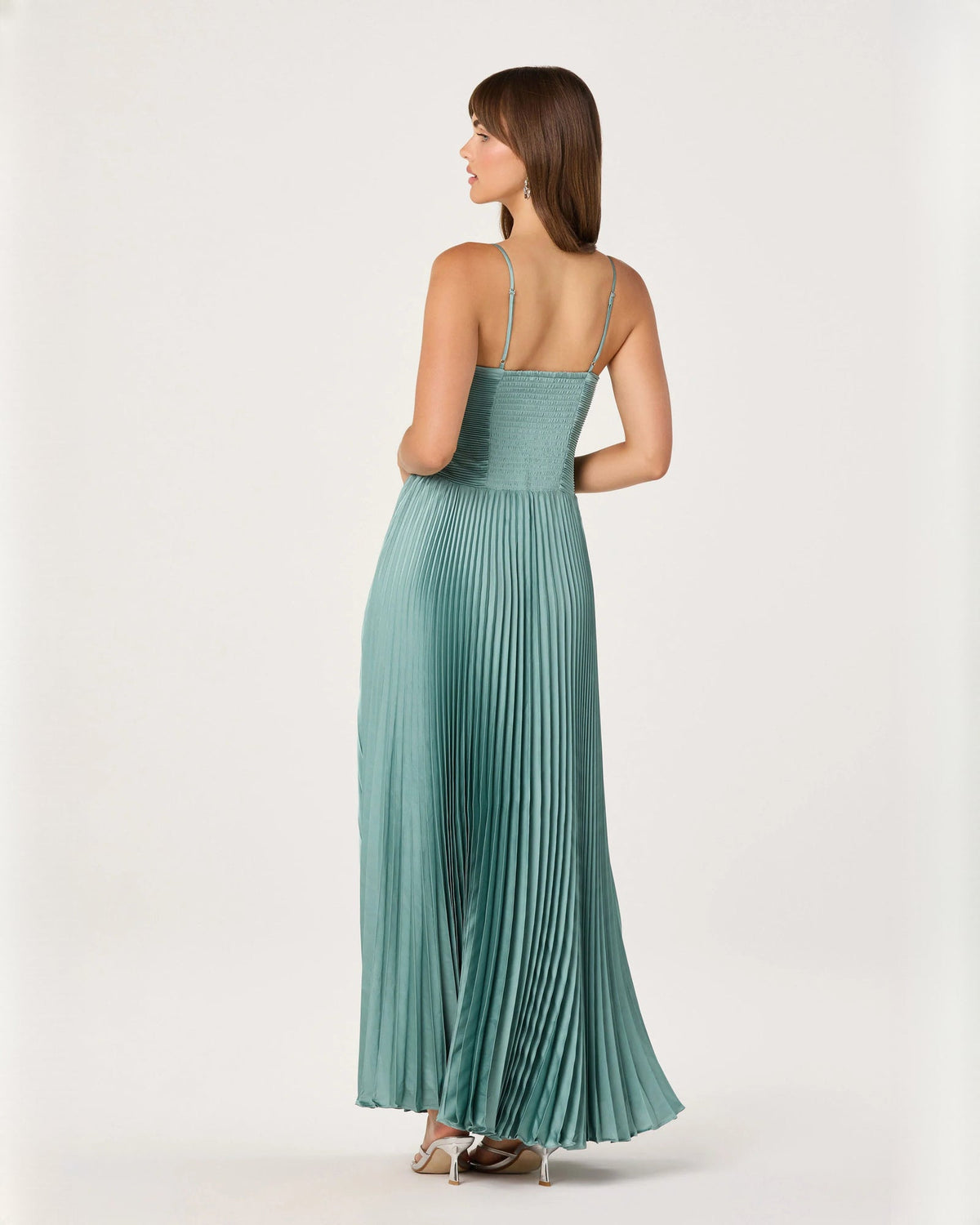 Seafoam green sleeveless A-line maxi dress with thin straps and open-back styling