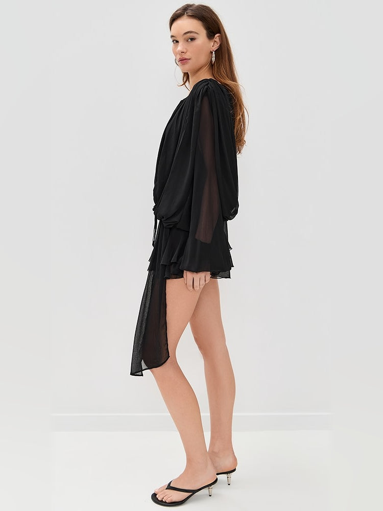 Black mini dress with draped front and asymmetrical sheer hem detail, long sleeves