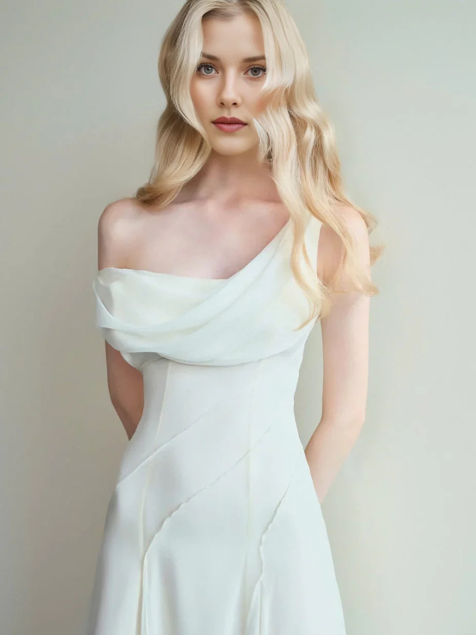 Ivory off-shoulder cowl-neck maxi dress with draped neckline and fitted bodice