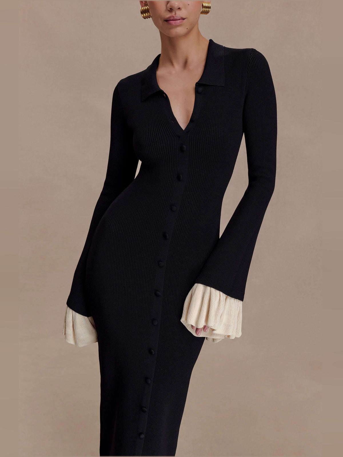Amirose black knit midi dress, V-neck button front, long sleeves, cream ruffle cuffs
