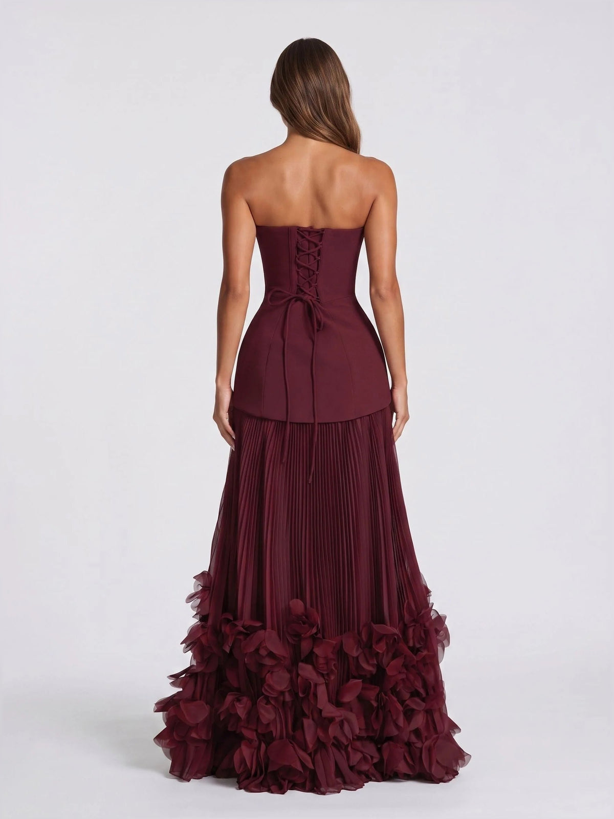 Cabernet strapless corset wedding dress, back view with tiered ruffle hem