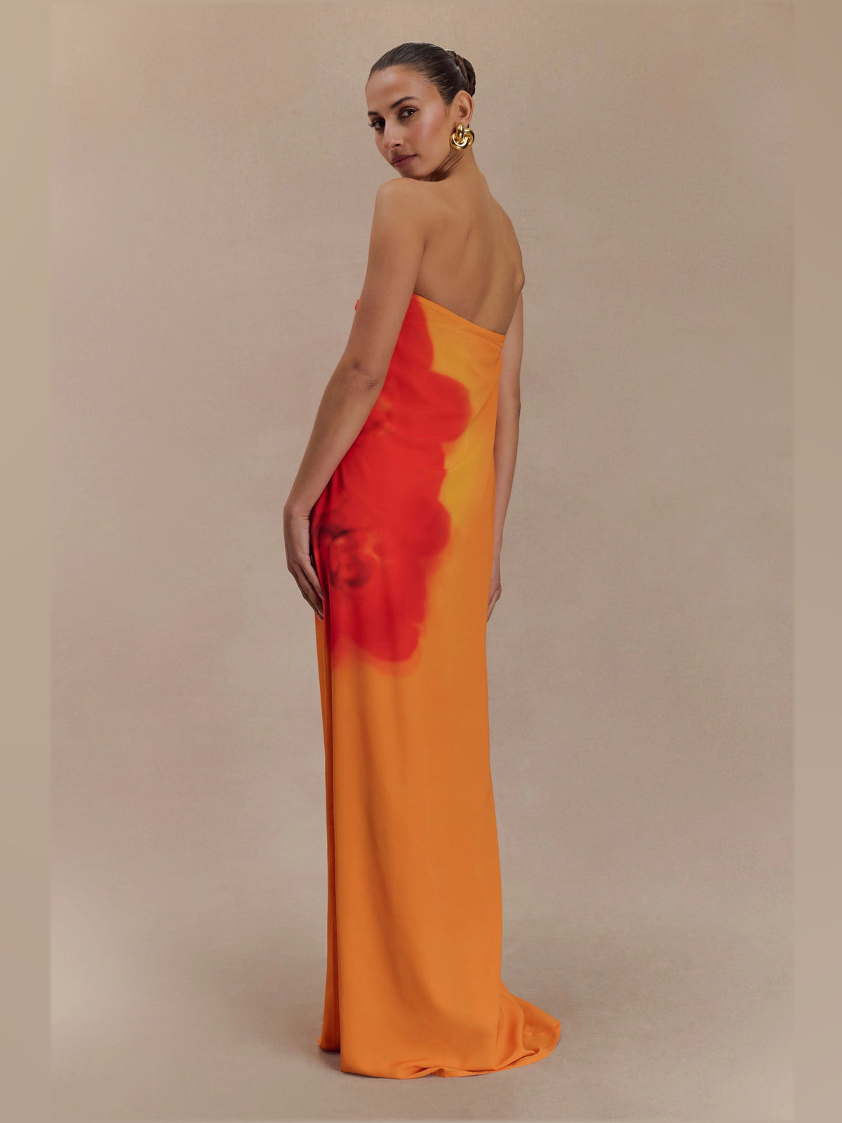 Orange formal dress with chiffon construction and maxi hem