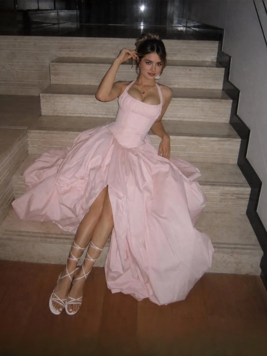 Blush pink sweetheart corset prom dress with spaghetti straps and voluminous tiered skirt