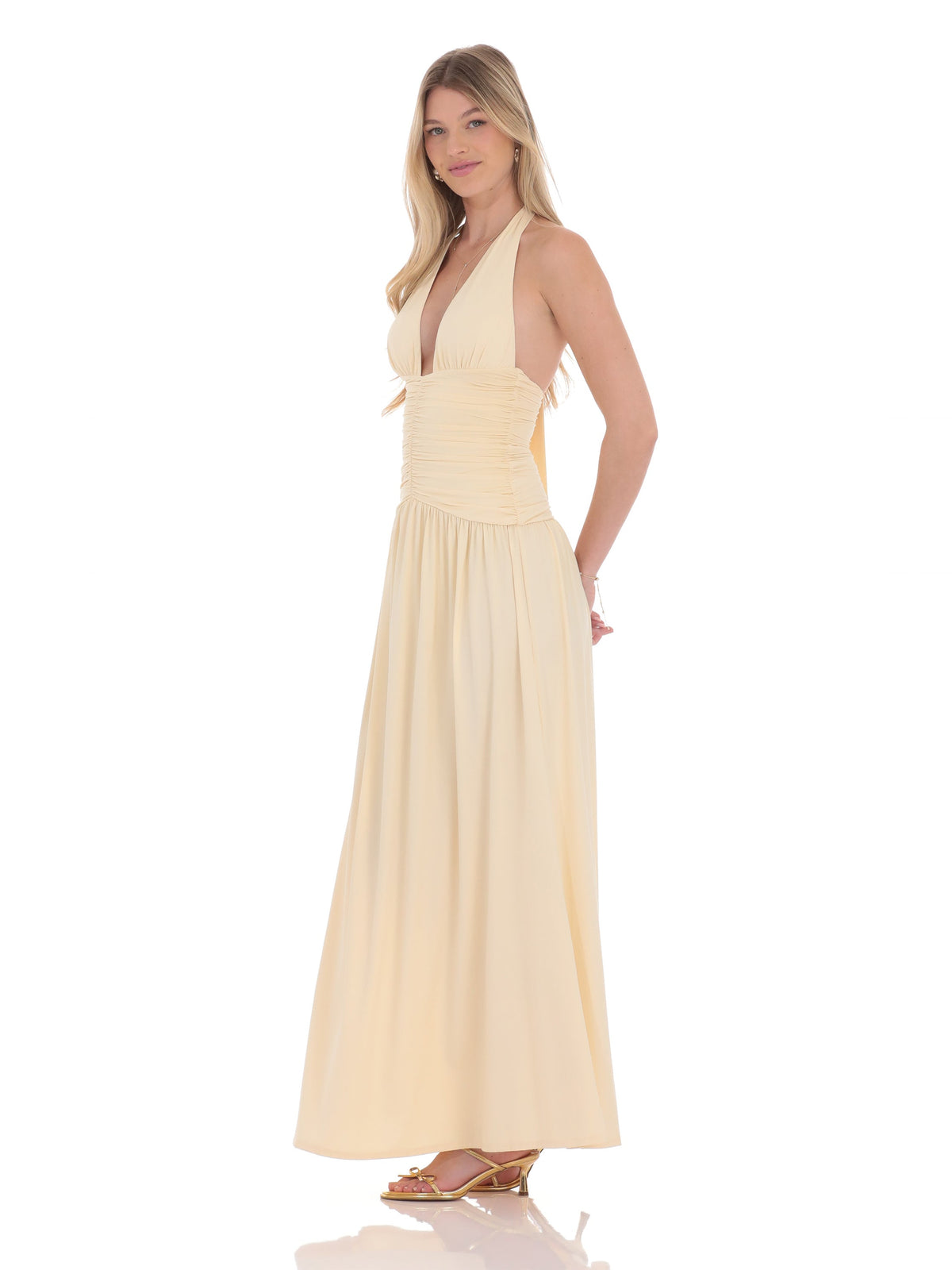 Beige bridesmaid dress with structured woven fabric construction and maxi hem