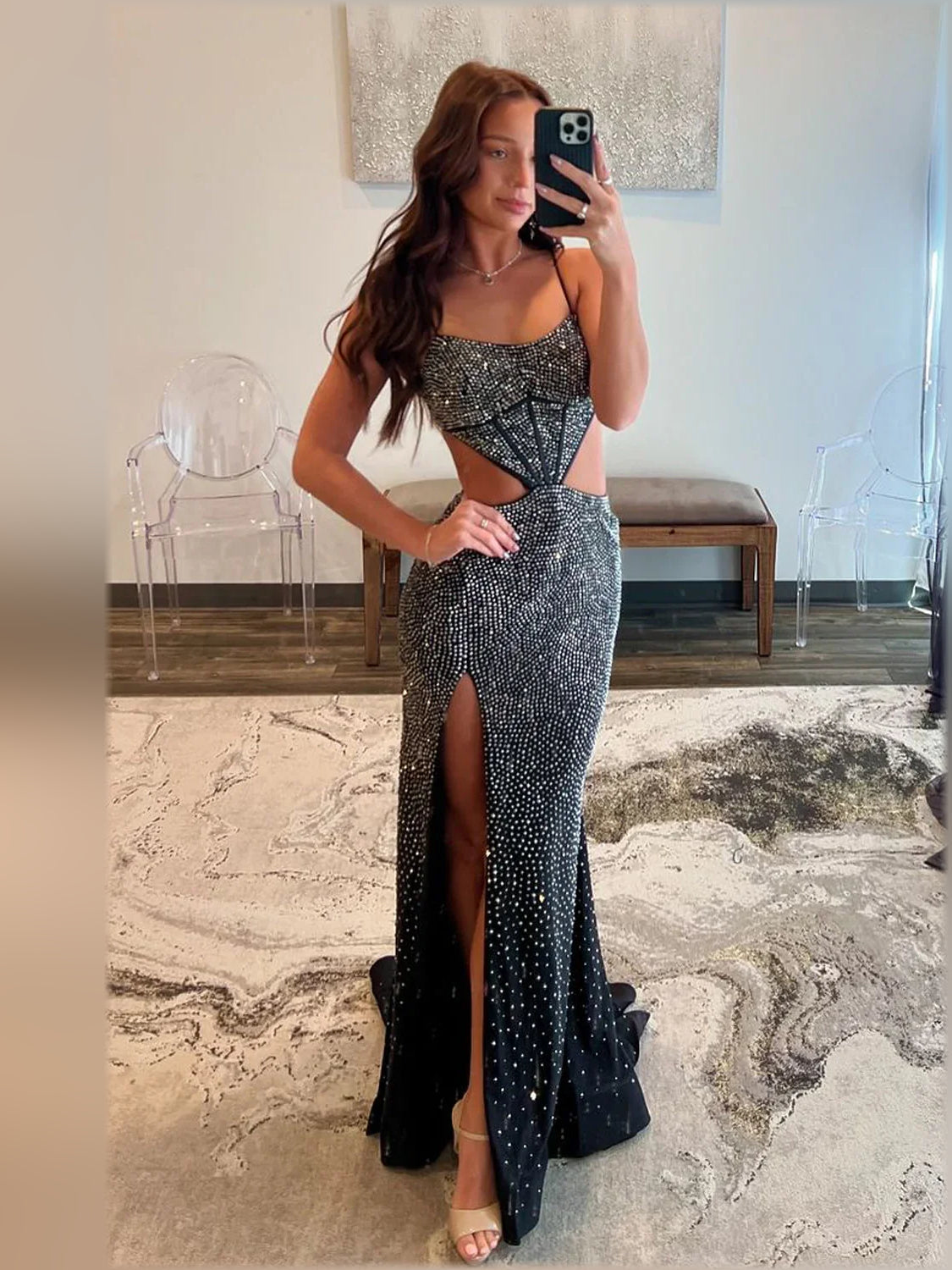 Black strapless sequin evening gown with front waist cutout and long slit, floor-length