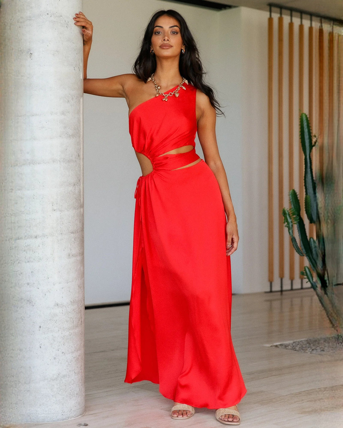 Red satin sleeveless A-line maxi bridesmaid dress with beaded shoulder detail and waist knot.