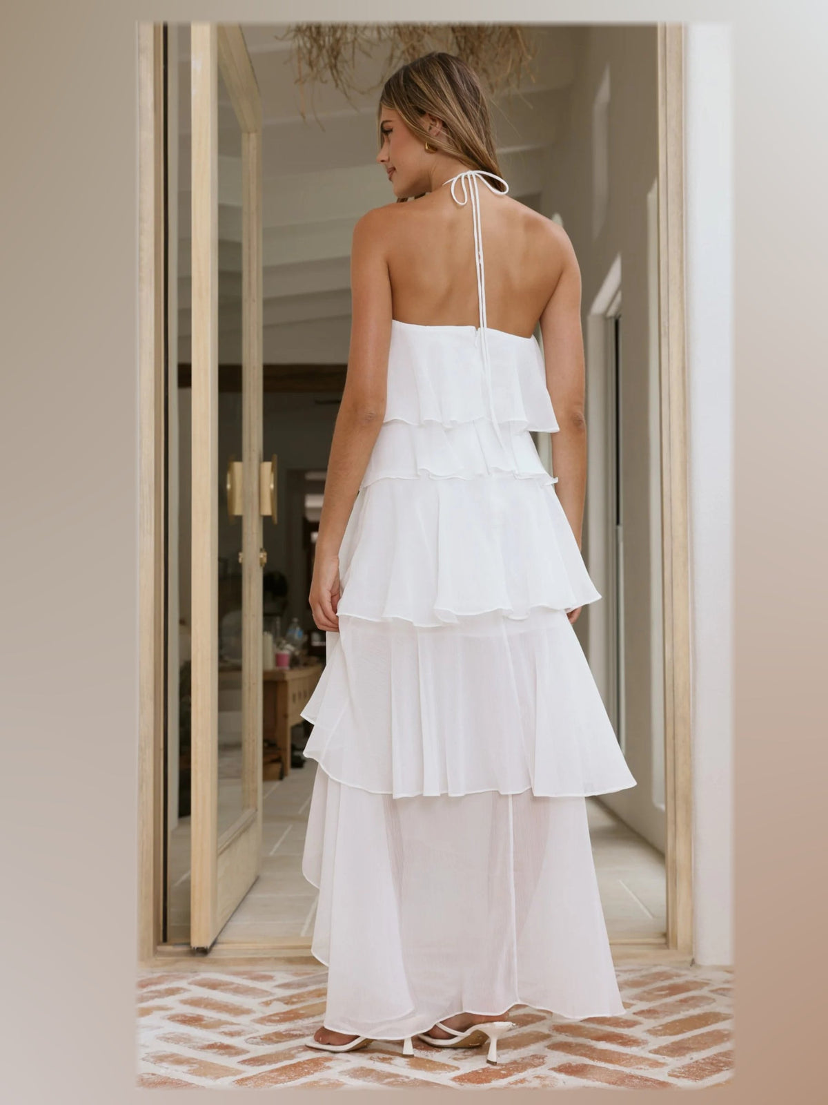 White formal dress with structured woven fabric construction and maxi hem