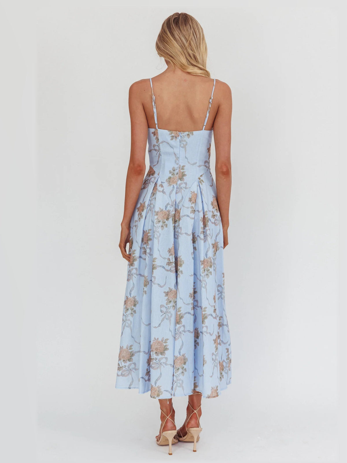 Blue formal dress with structured woven fabric construction and maxi hem