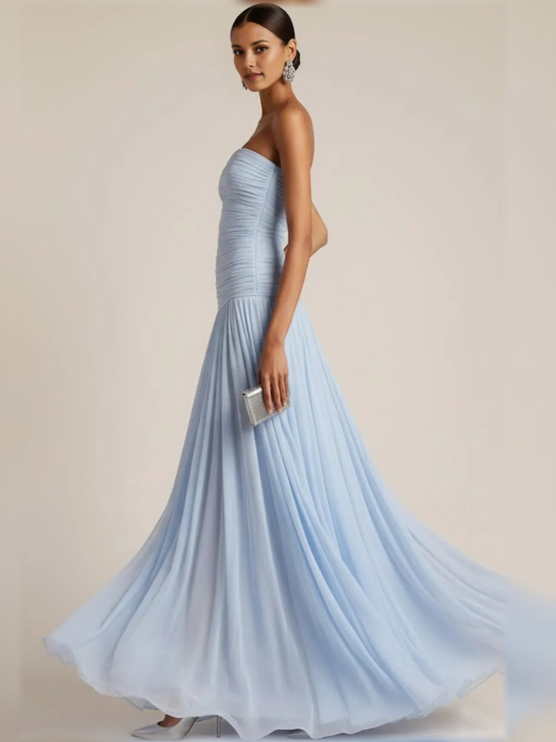 Light blue strapless ruched dress with pleated skirt and floor-length flow