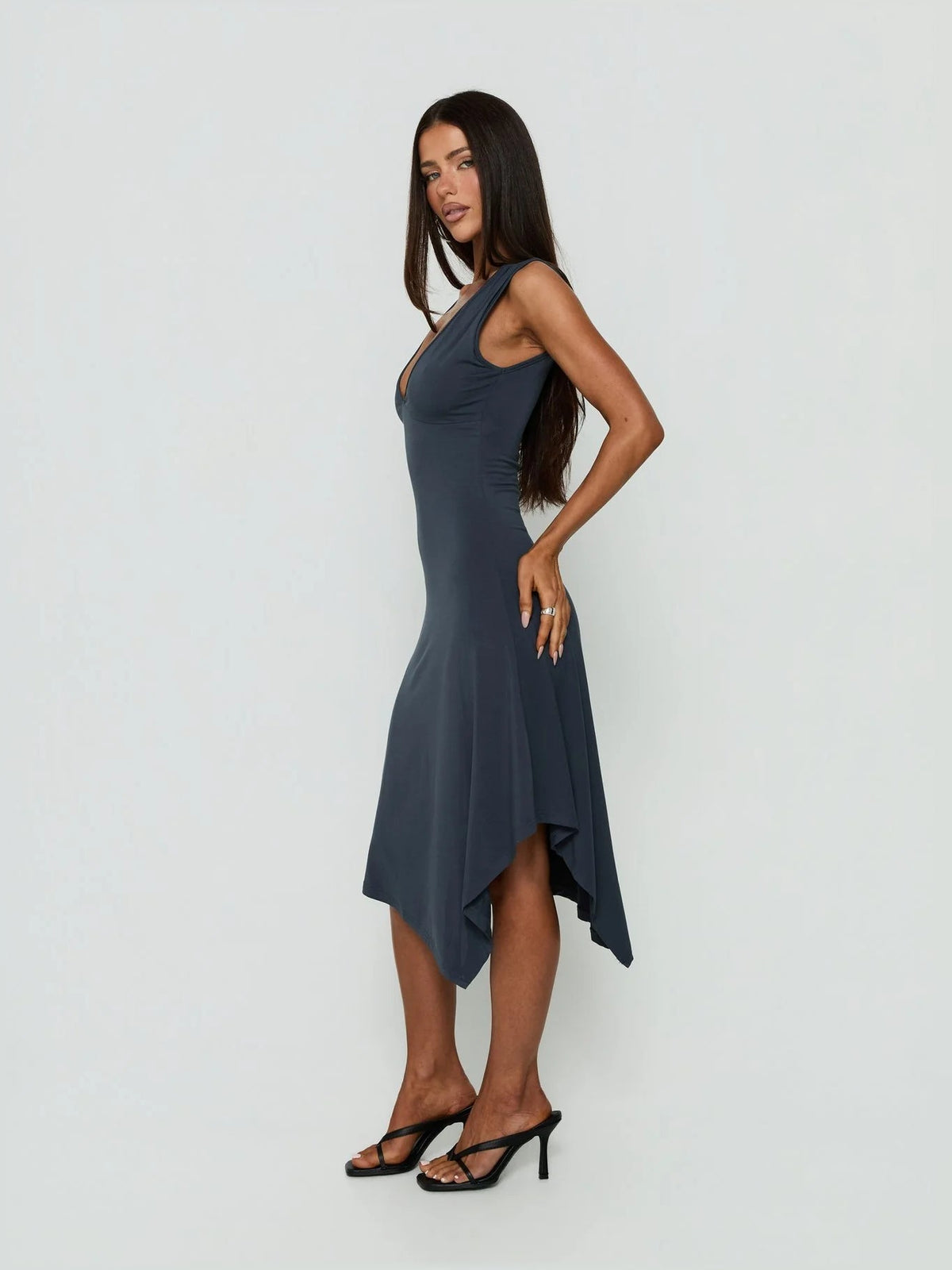 Sleeveless V-neck midi dress with draped hanky hem, angled back and asymmetrical drape