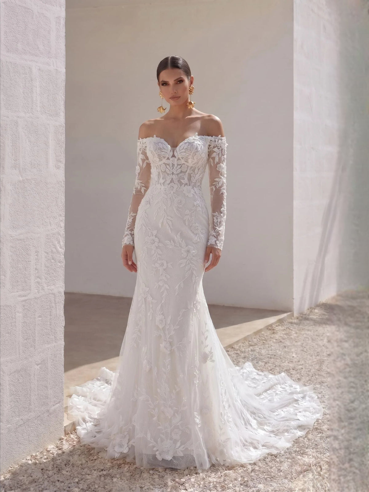 Ivory sweetheart mermaid wedding dress with embroidered floral bodice and long tulle skirt
