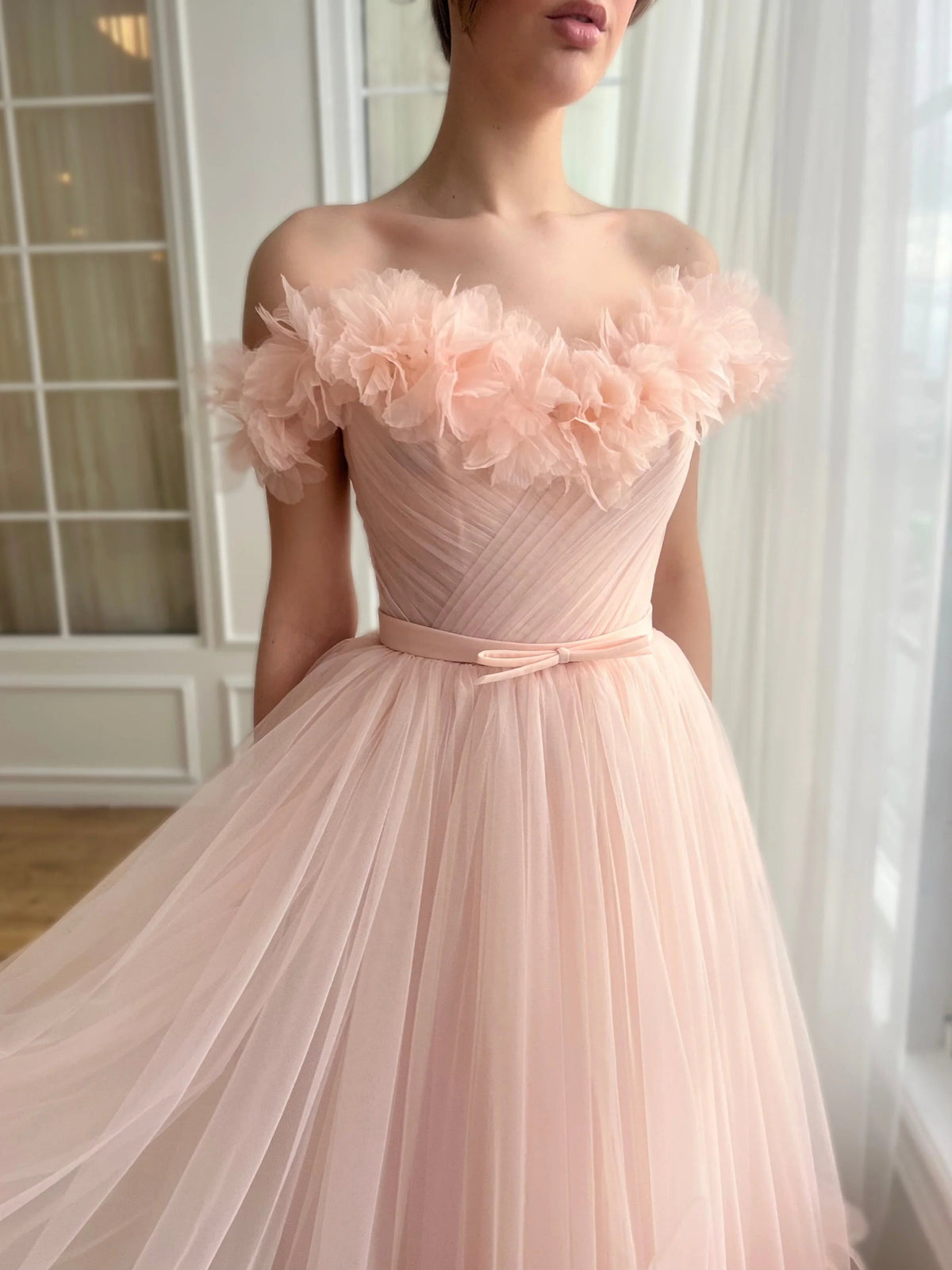 Peach off-shoulder midi prom dress with ruffled neckline, pleated waist and satin skirt