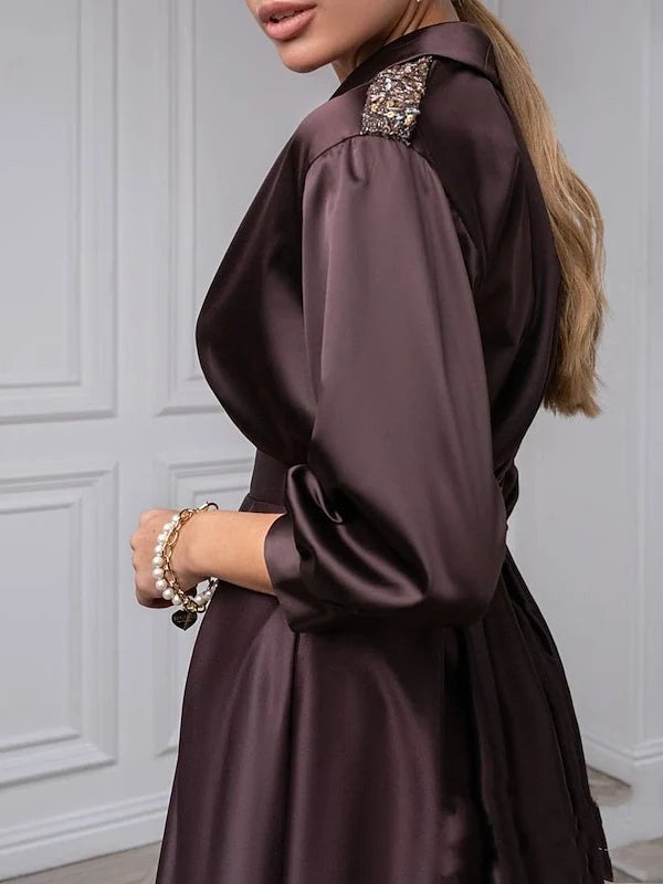 Deep purple satin dress with draped V-neck and embellished neckline on long puff sleeve