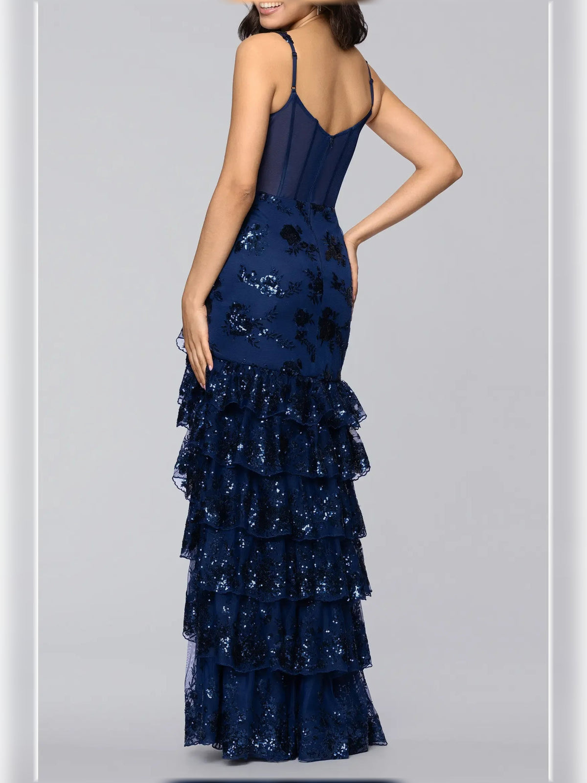 Navy blue floral print sweetheart formal dress with spaghetti straps and tiered ruffle hem