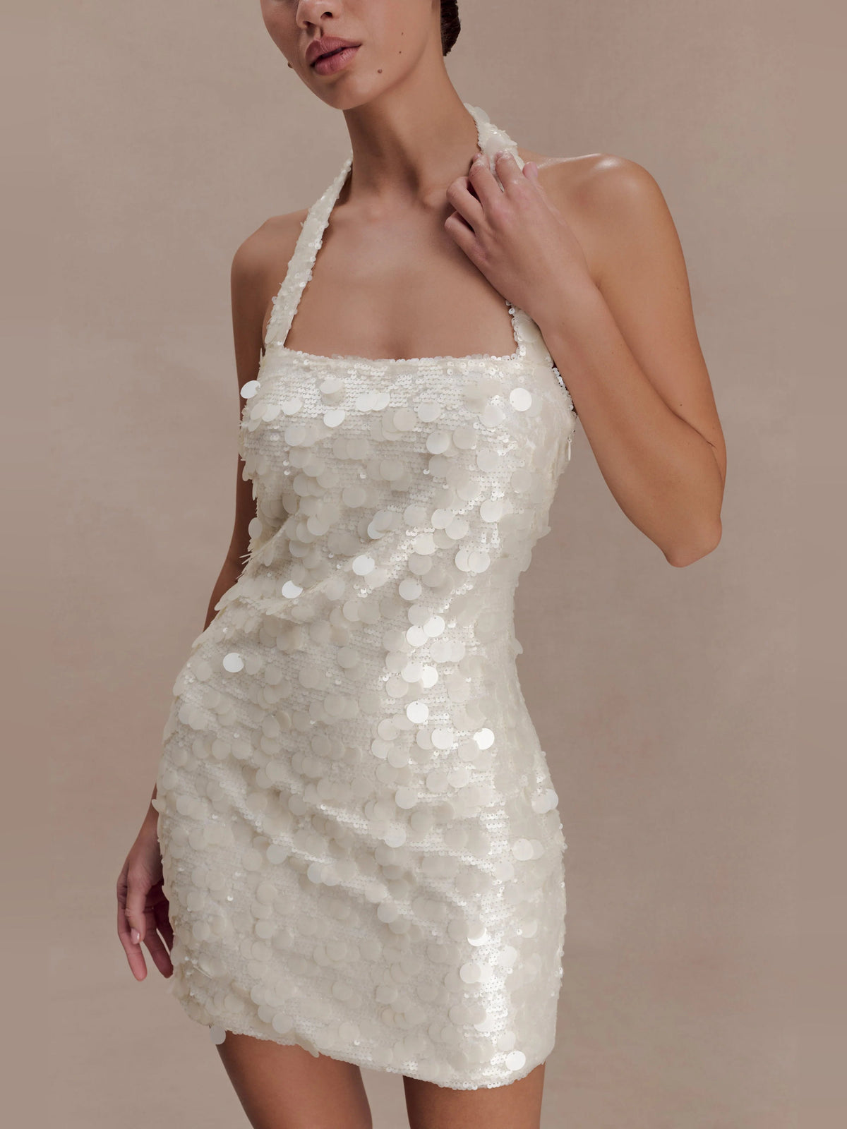 Ivory sequin halter-neck mini dress with fitted bodice and short hem