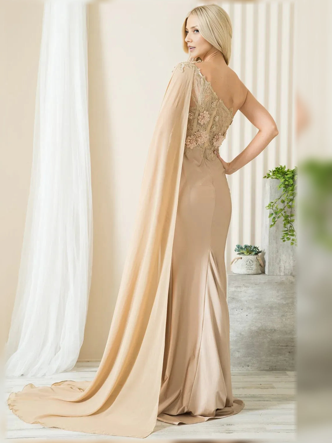 One-shoulder mermaid formal dress in champagne with floral lace back and long train.