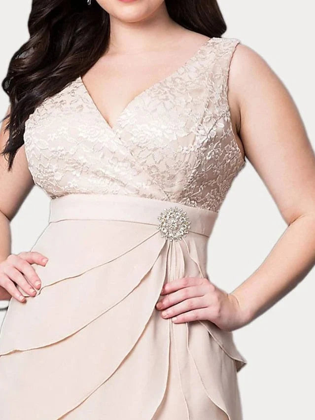 Blush pink V-neck lace bodice dress with draped waist and layered ruffle skirt