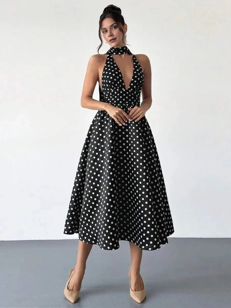 Black and white polka dot V-neck midi A-line dress with halter neck and open back