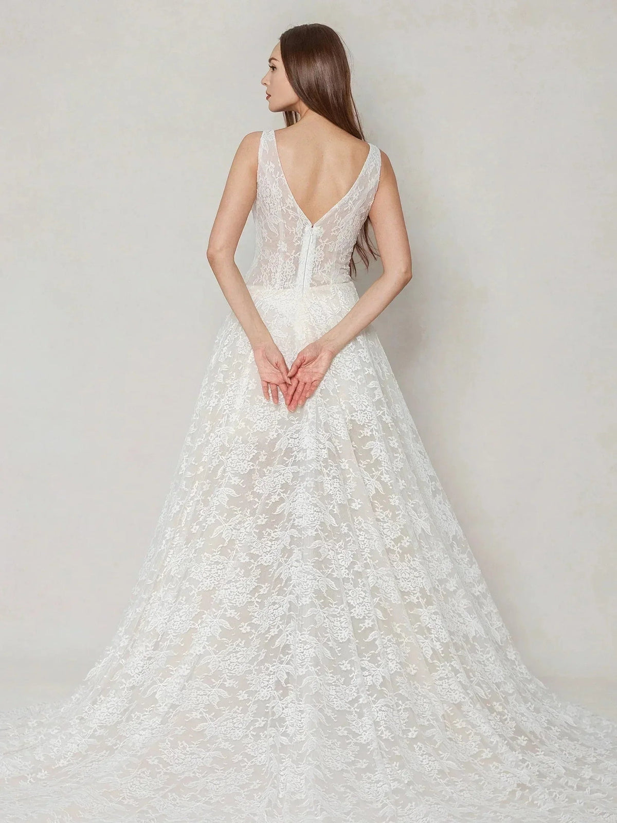 Ivory lace wedding dress with open back, V-neck front, sleeveless A-line skirt