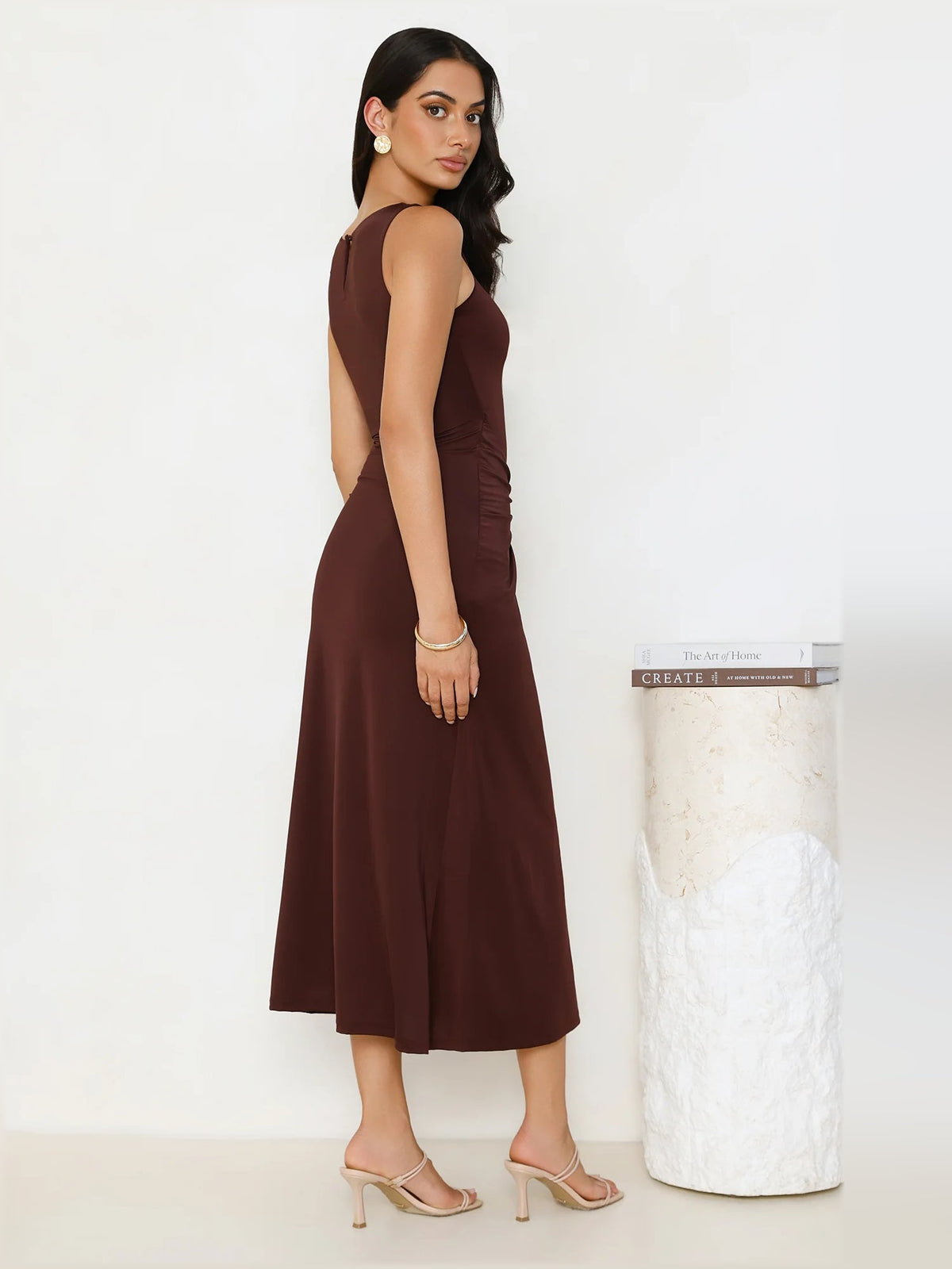 Chocolate sleeveless midi dress with ruched bodice and draped side silhouette
