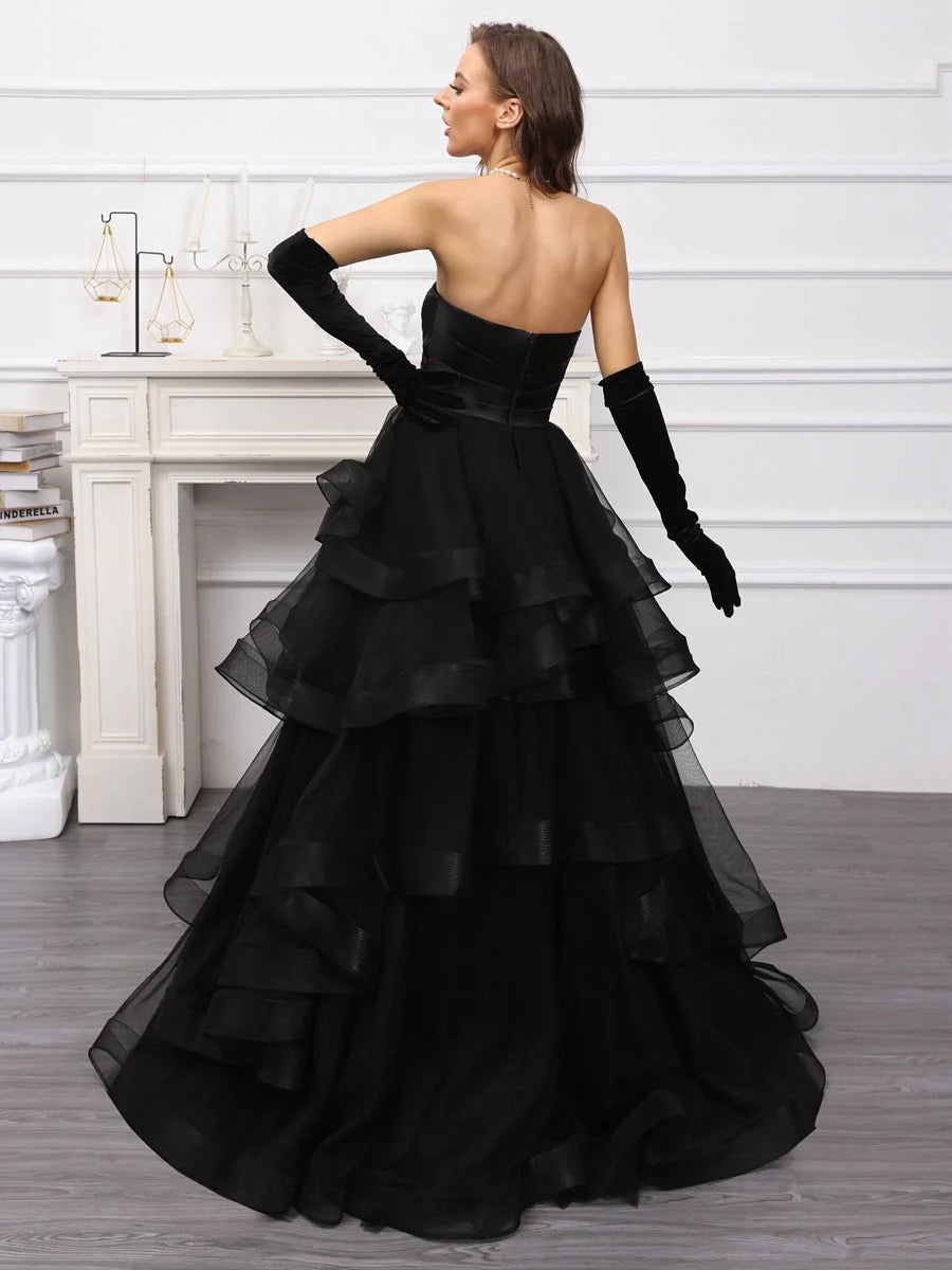 Black sweetheart A-line satin wedding dress, tiered ruffle skirt; open back view with gloves