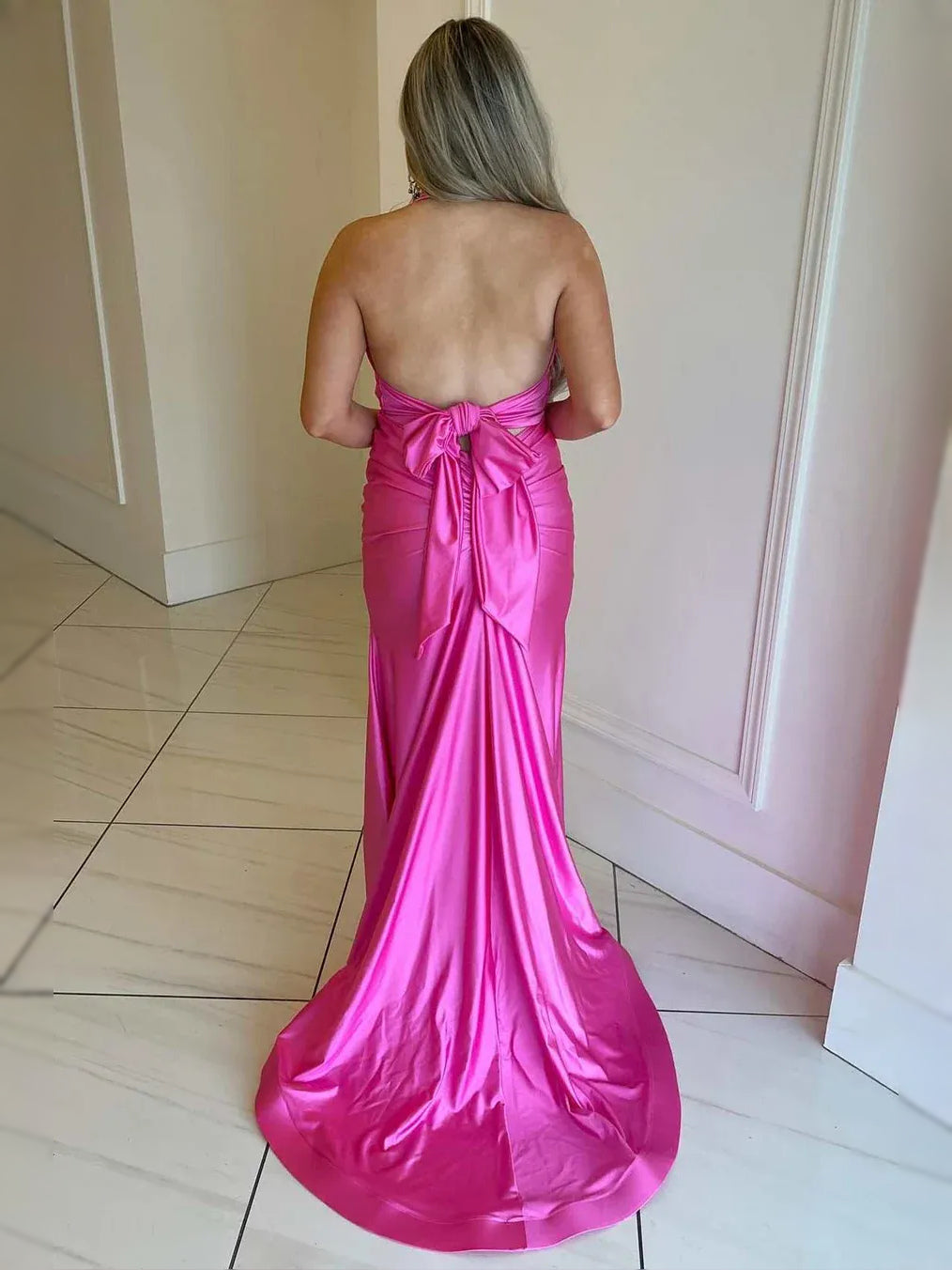Hot pink satin mermaid prom dress with ruched draped open back and flowing mermaid skirt