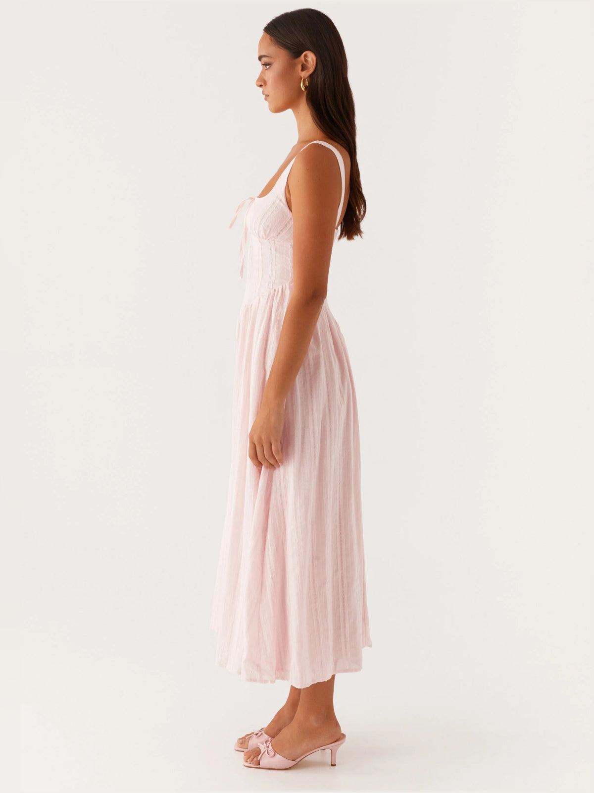 Pink midi formal dress shown from the side with square neckline and straps