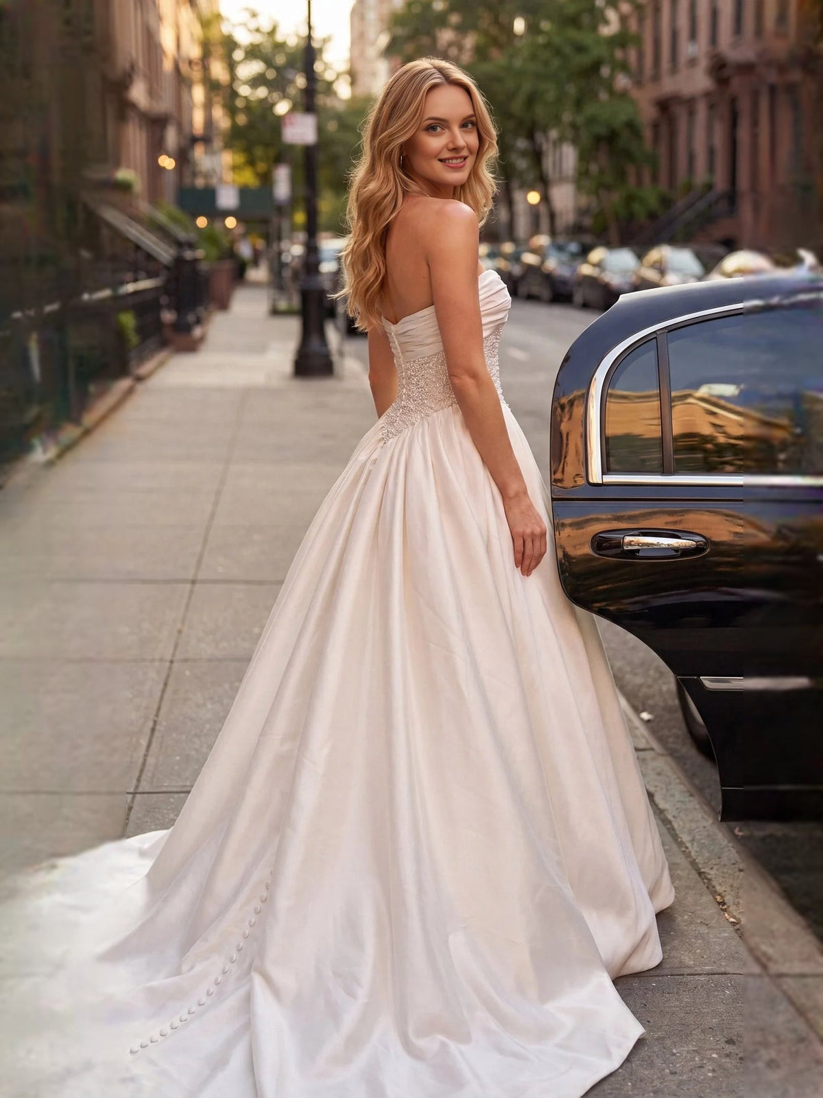 Ivory strapless A-line satin wedding dress with beaded waist detail and draped neckline